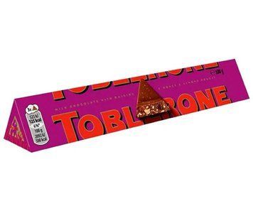 Шоколад молочний з нугою,мигдалем та родзинками Toblerone 100г. 00317-2 фото